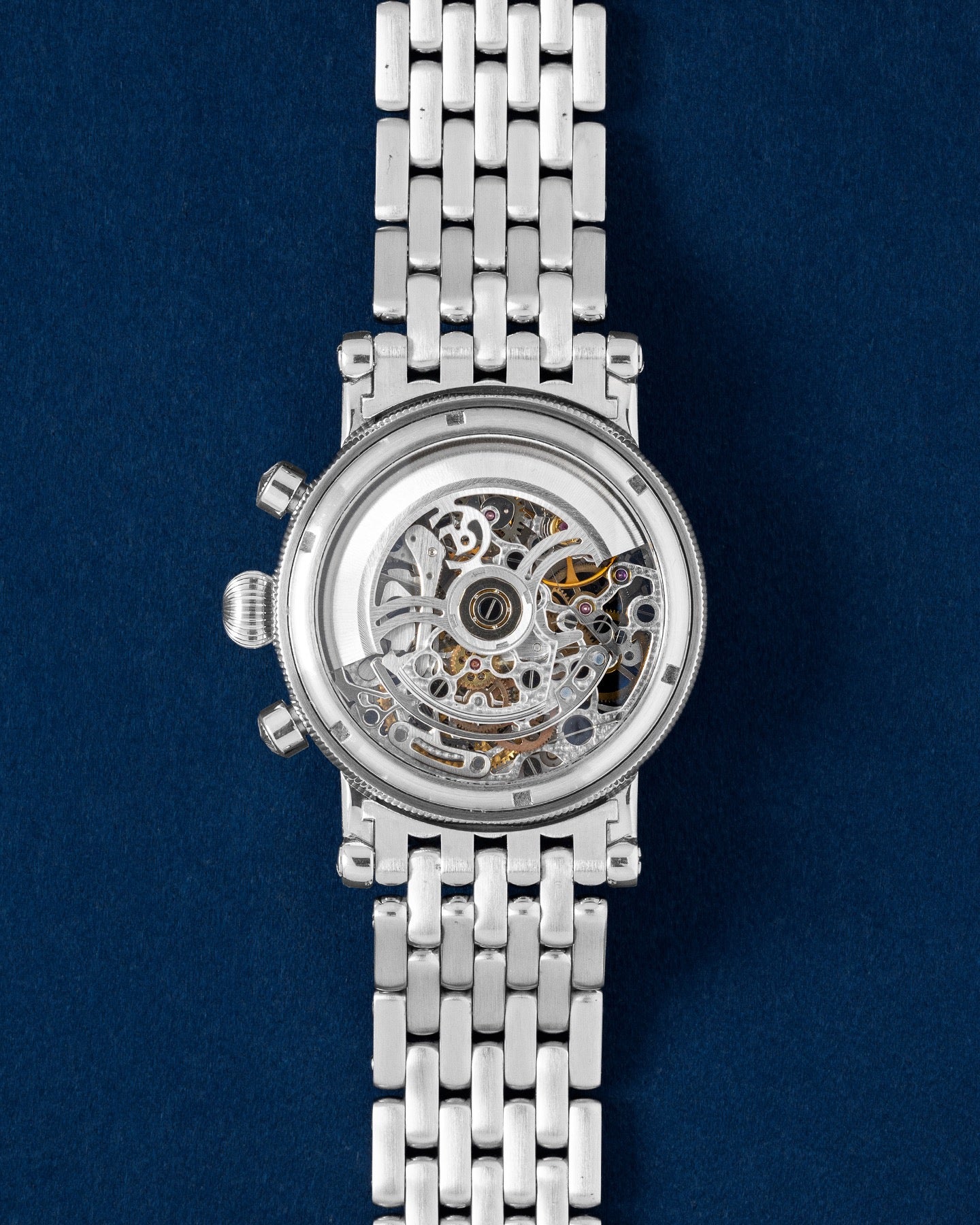 transparent sapphire exhibition caseback revealing the heavily skeletonized Caliber C.741 automatic movement