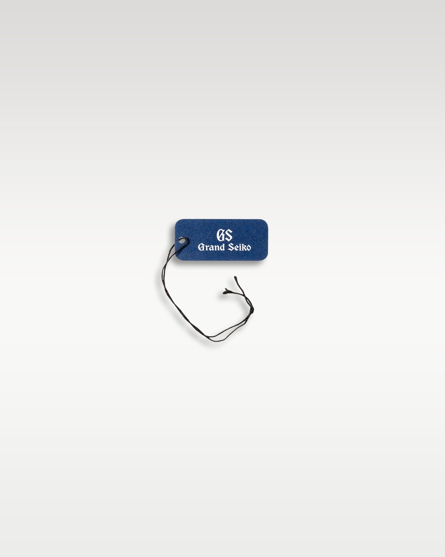 A secondary blue branded retail string component used to secure original factory tags to the metal bracelet links