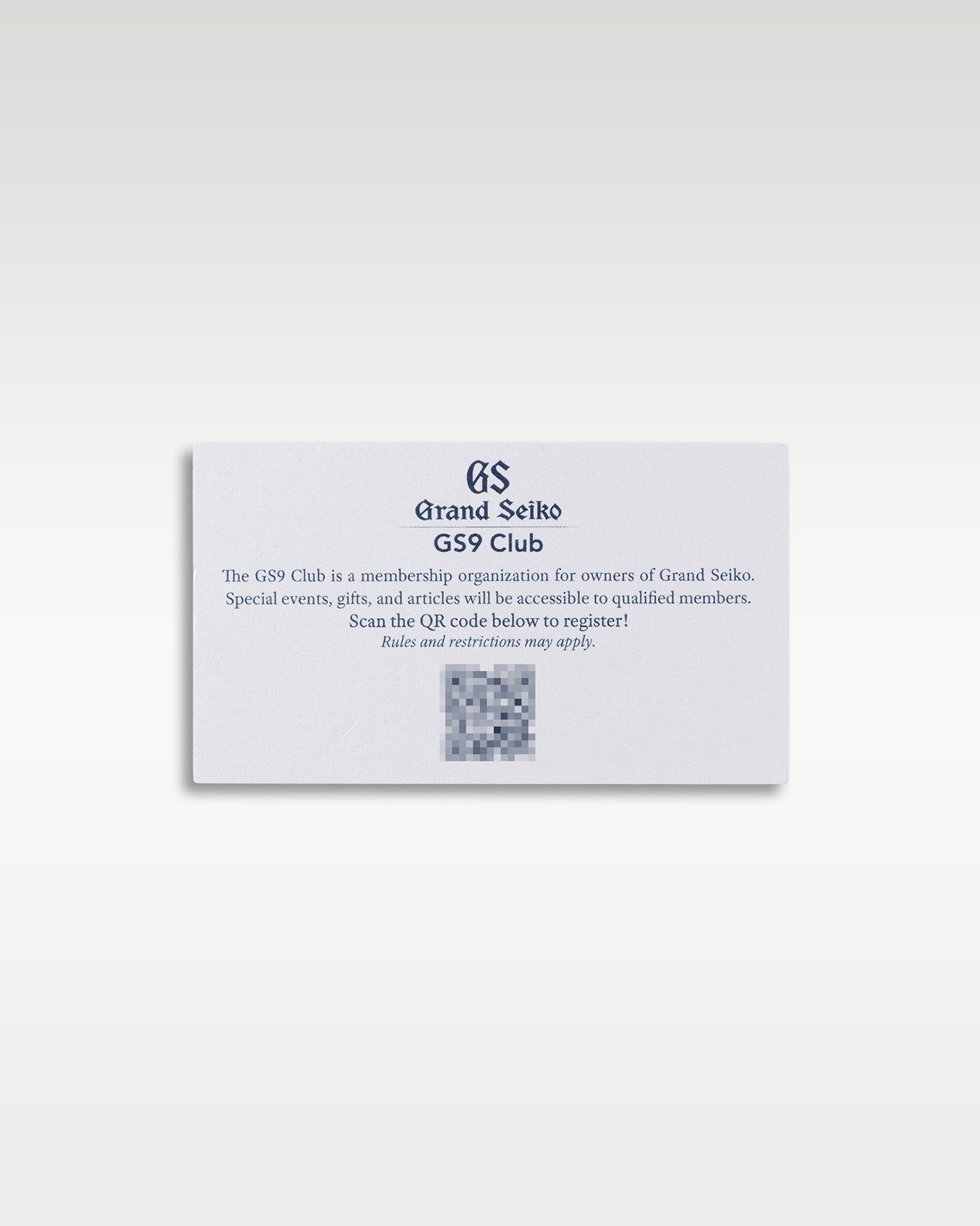 reverse side of a white Grand Seiko international warranty card showing a security QR code