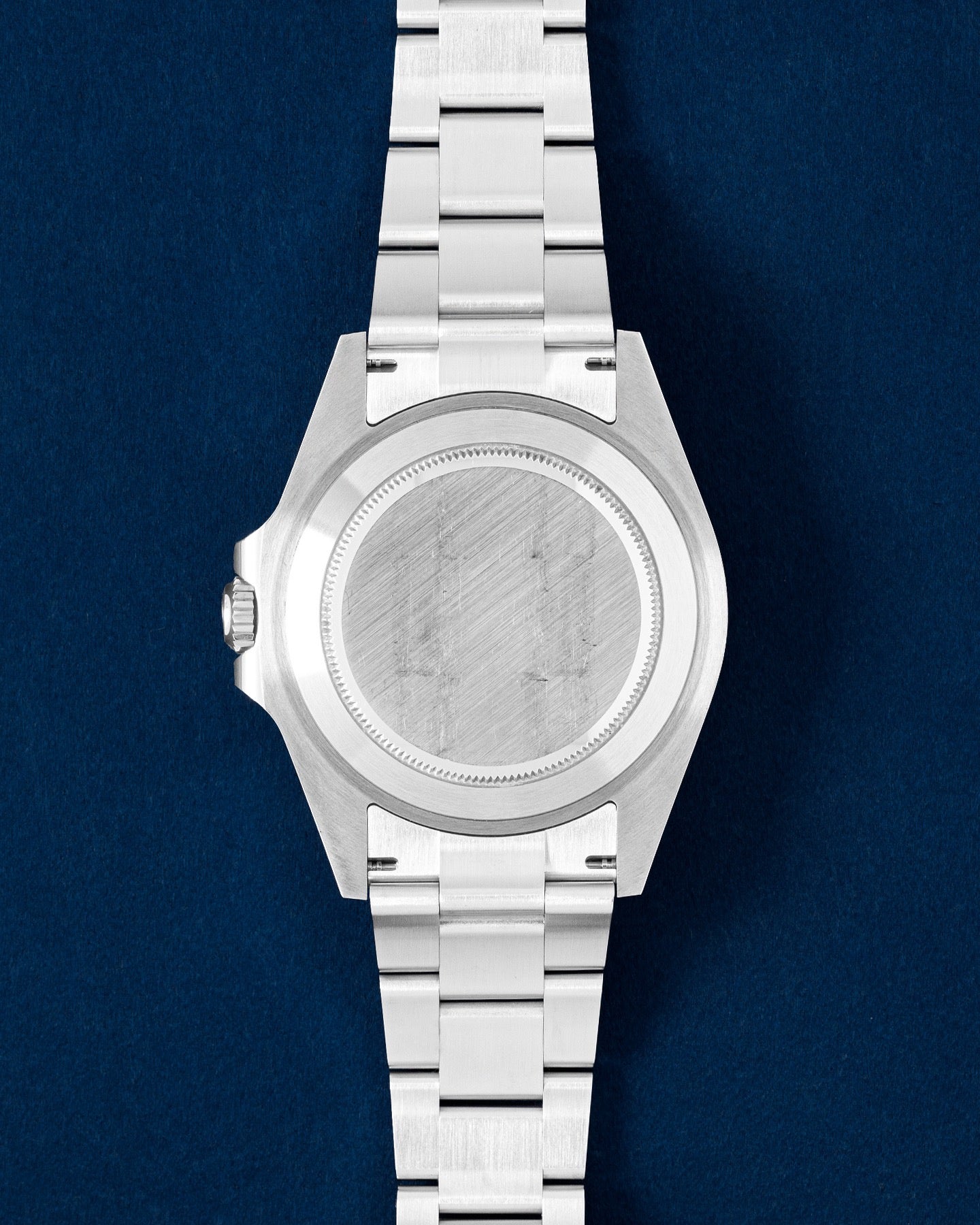 Oystersteel screw-down caseback on a 42mm Rolex Explorer II luxury sports watch