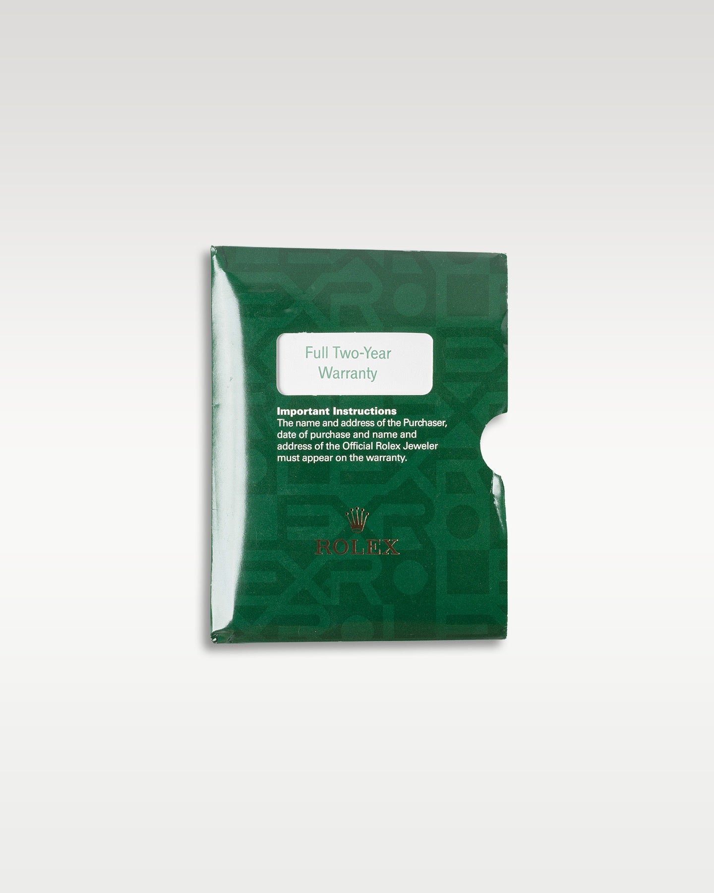 top-down overview of the classic green grained leather Rolex wallet sleeve used for holding the warranty certificate paper