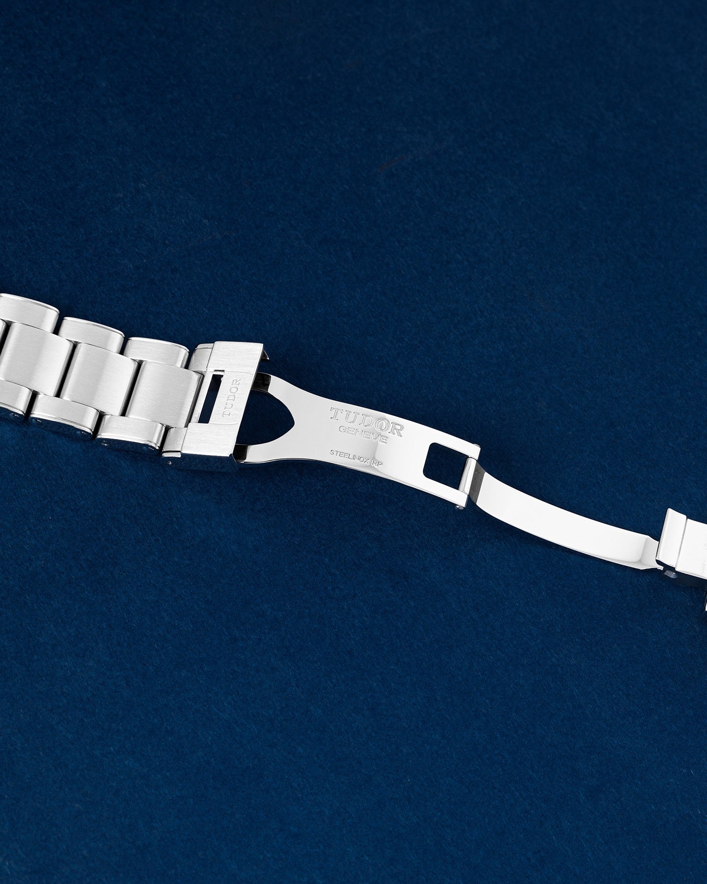 open stainless steel deployment clasp mechanism on a Tudor Black Bay bracelet