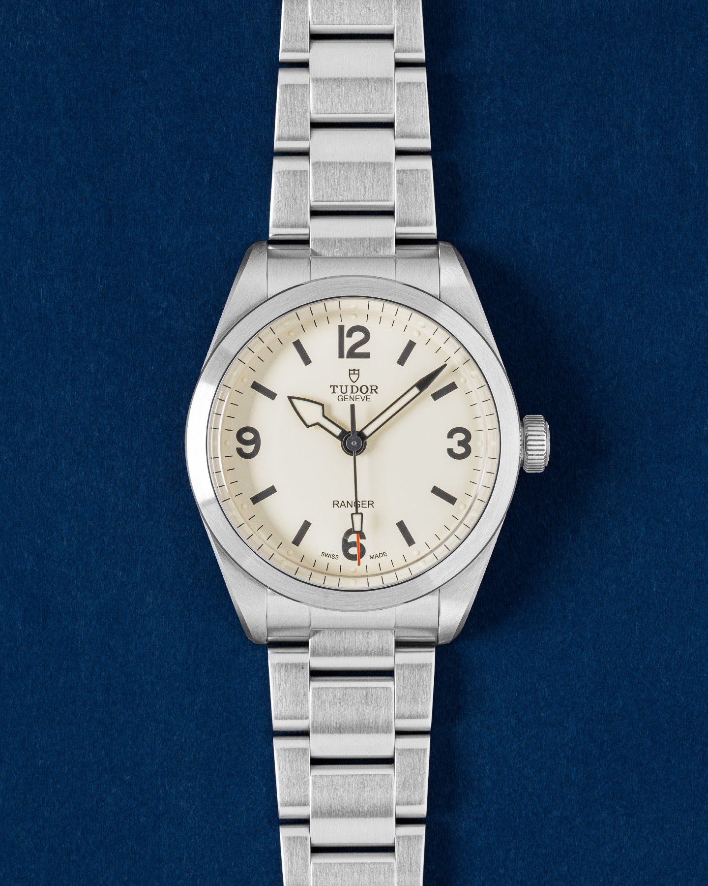 Tudor Ranger 39mm watch featuring a Dune white dial, painted Arabic numerals, a red-tipped seconds hand and a steel bracelet