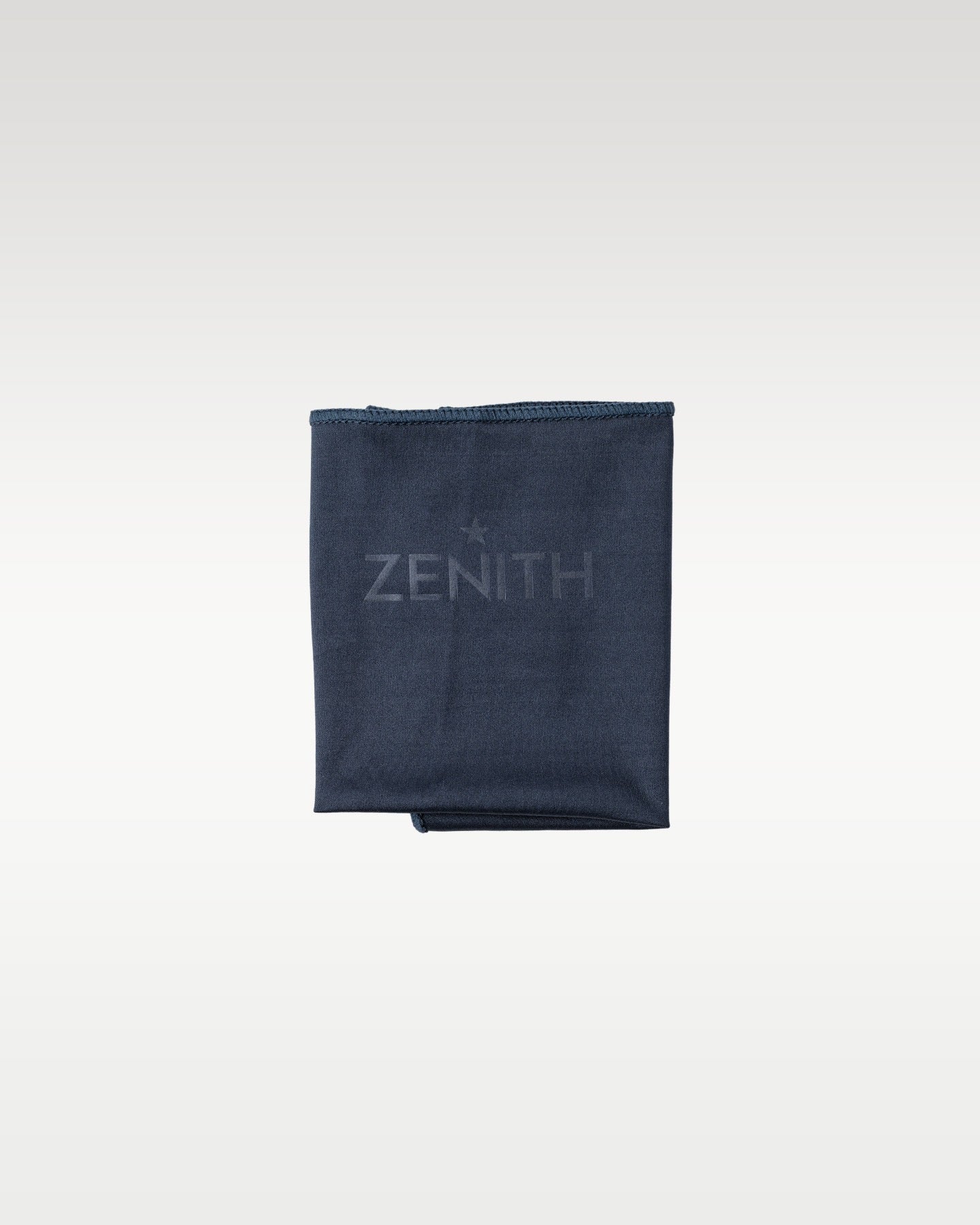 Official dark blue Zenith branded microfiber polishing cloth packaged with the watch