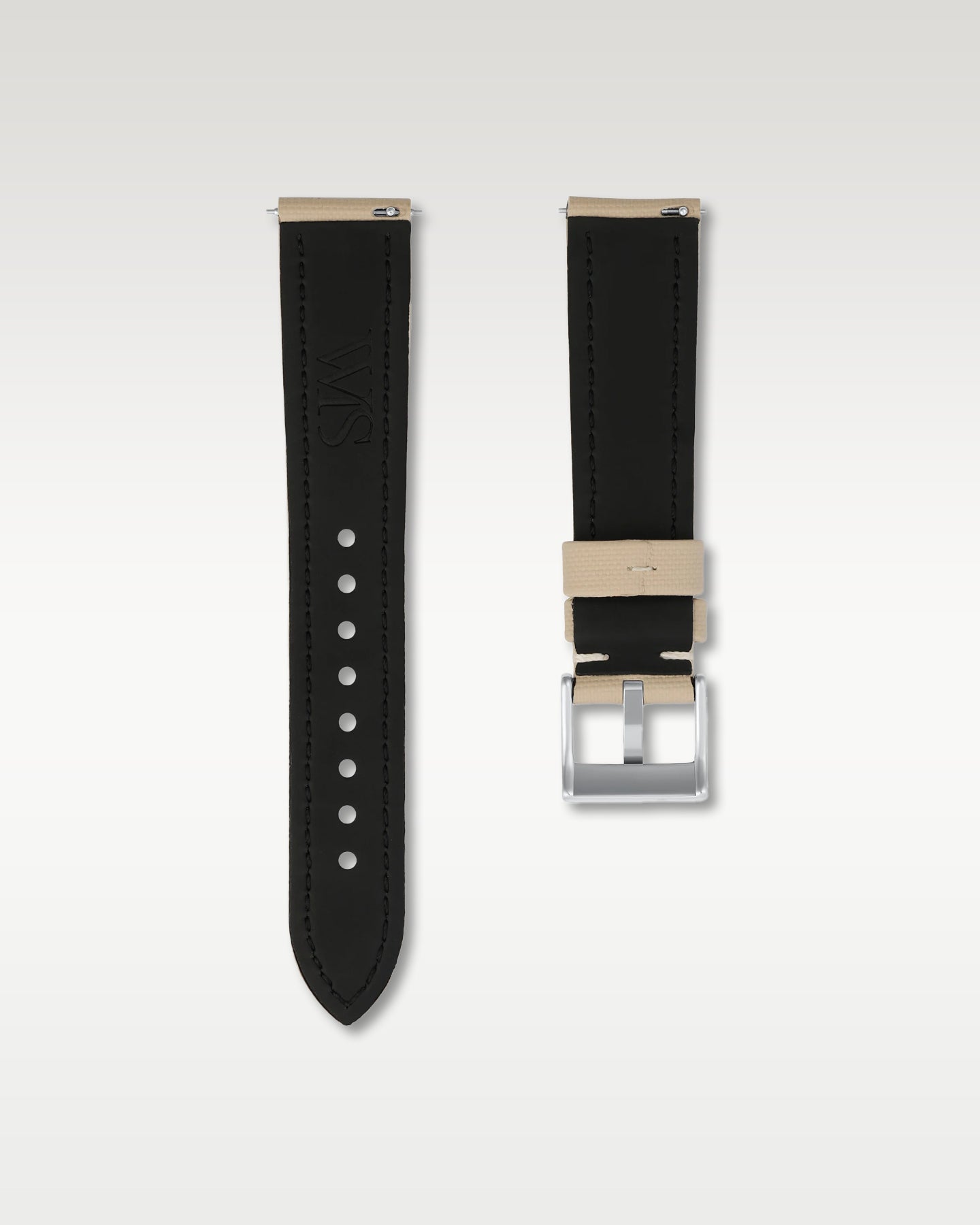 Reverse side of a beige 20mm watch band revealing the black inner lining, integrated quick-release pins, and engraved WIS hardware