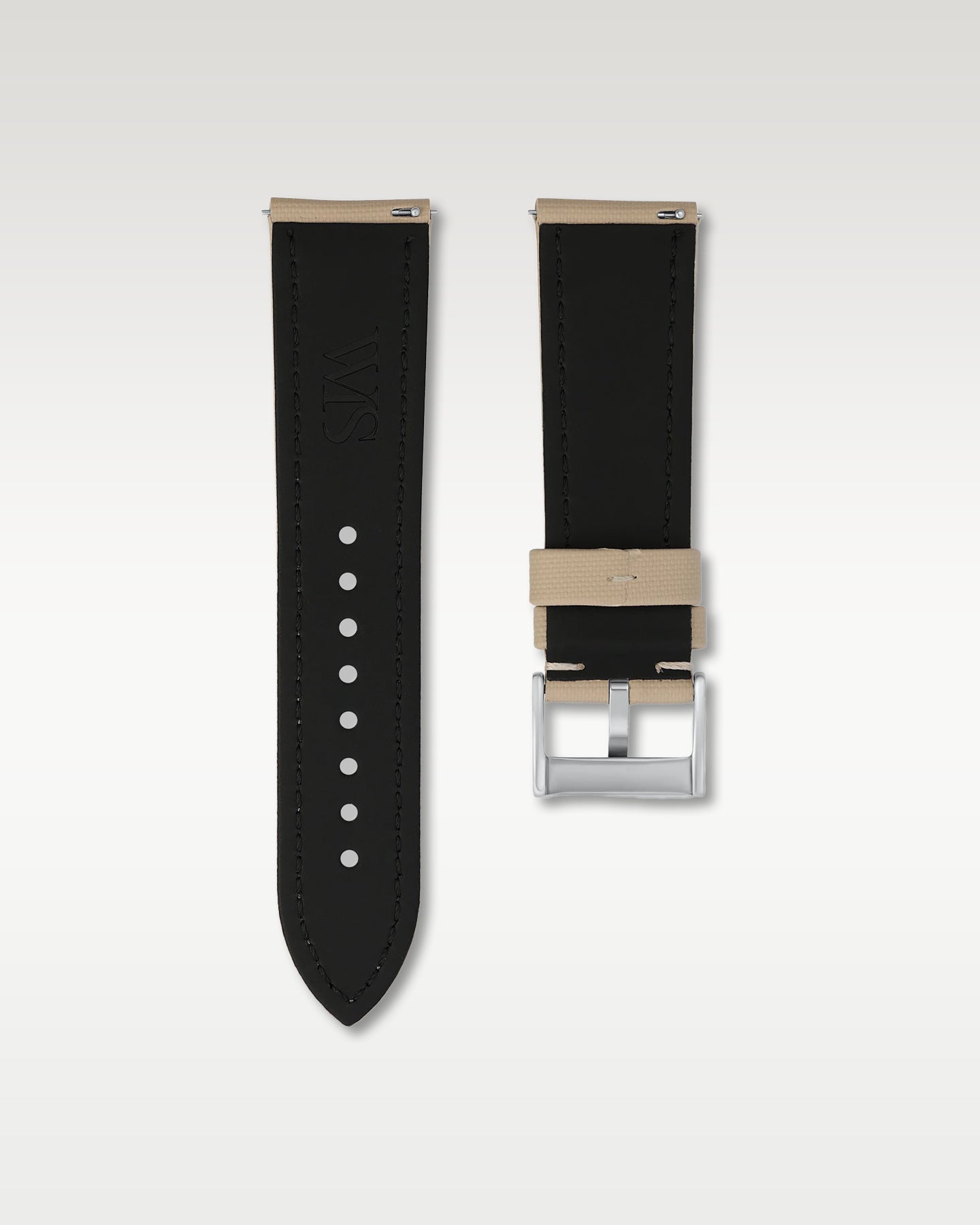 Reverse side view of a 24mm beige sailcloth watch band highlighting the dark lining, integrated quick-release pins, and WIS engraving
