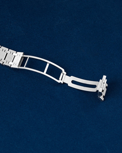 open stainless steel asymmetric folding deployment clasp mechanism on an Audemars Piguet Royal Oak Jumbo bracelet