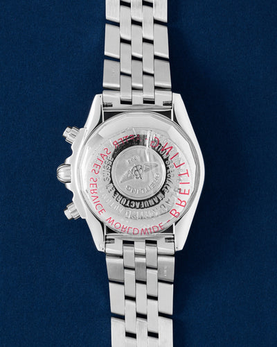 solid brushed stainless steel caseback of a Breitling Blackbird watch showing the official conversion scales and serial engravings