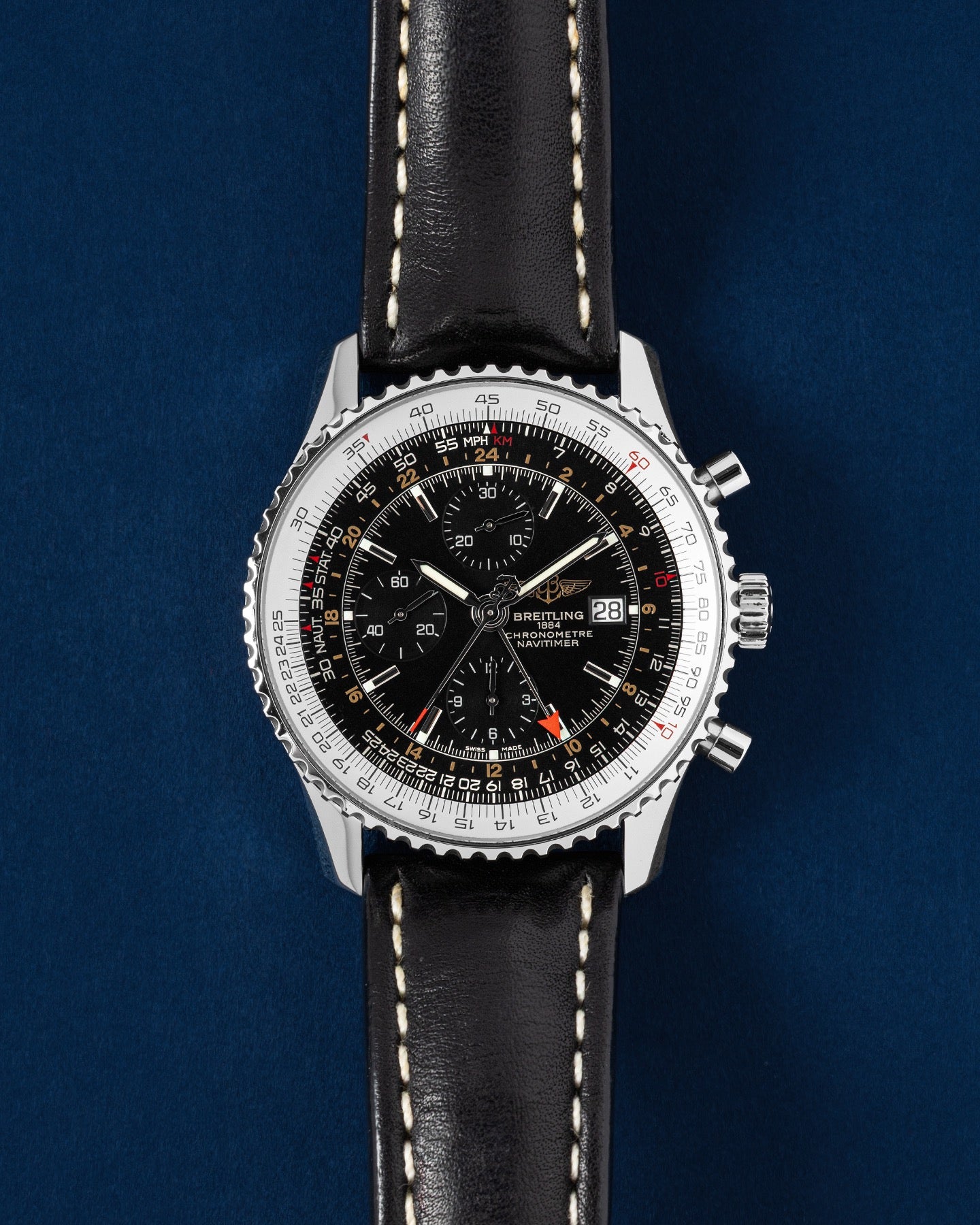 Breitling Navitimer World A2432212/B726, black dial with slide rule bezel and GMT hand, brown leather strap, front view
