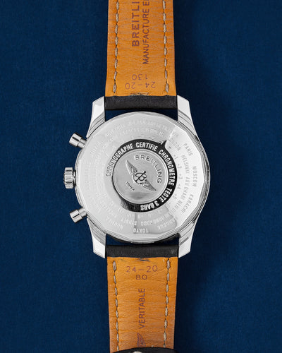 Breitling Navitimer World A2432212/B726, worn on brown leather strap, angled wrist view
