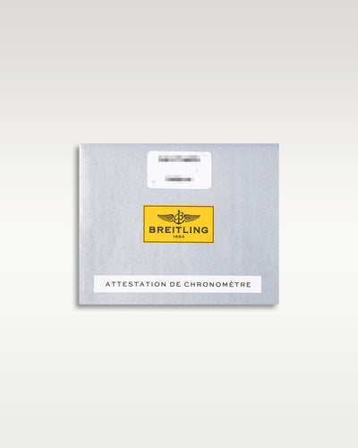 Official silver and yellow Breitling COSC international chronometer certification paper documentation