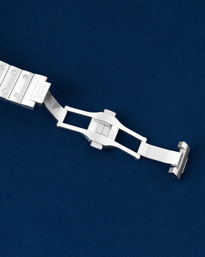 Close-up of the open deployment folding buckle clasp on a Cartier Santos steel bracelet
