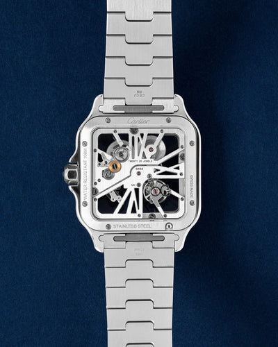 Blue Bezel Skeletonized Cartier Santos WHSA0026 | Grand Caliber Watches 