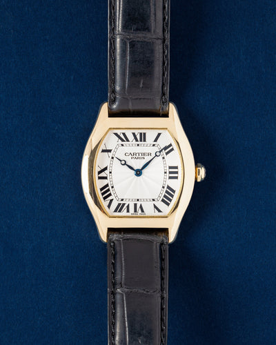 Cartier Tortue XL Collection Privee Paris 2496C 18k yellow gold mechanical watch with a silver guilloche dial on a blue background