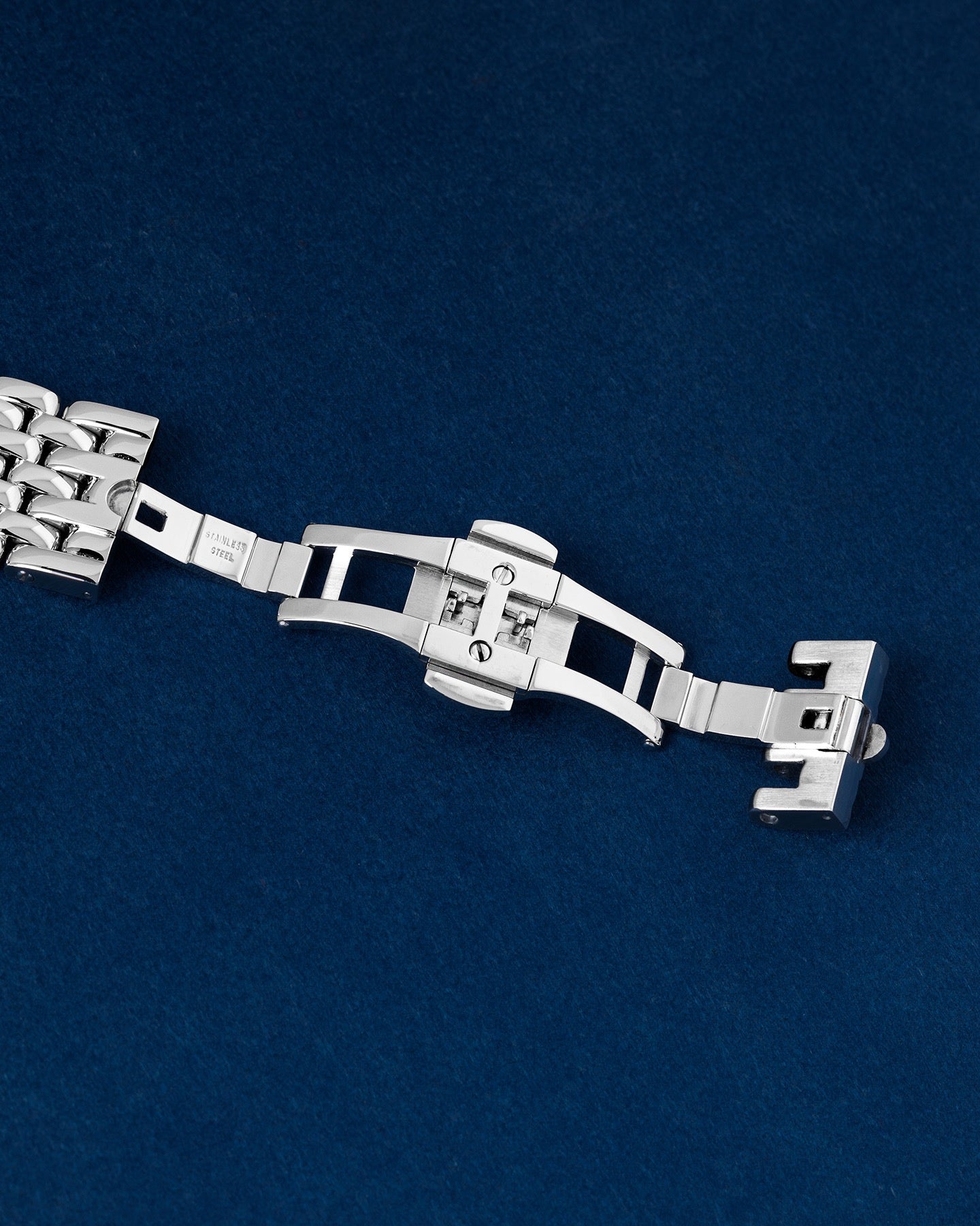 open stainless steel double-folding deployment clasp mechanism on a Chronoswiss watch bracelet