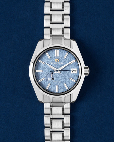 A preowned 2024 Grand Seiko Heritage SBGA507 showcasing its pale ice-blue Kirazuri sparkling mica dial texture and smooth gliding sweep hand at Grand Caliber in Dallas