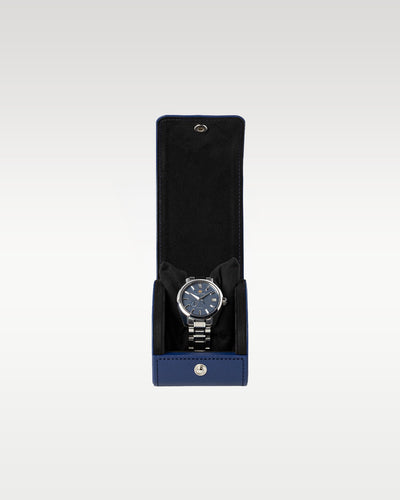 The complete secondary travel layout showing the ice blue Kirazuri dial watch secured inside an official black leather snap-button travel roll envelope