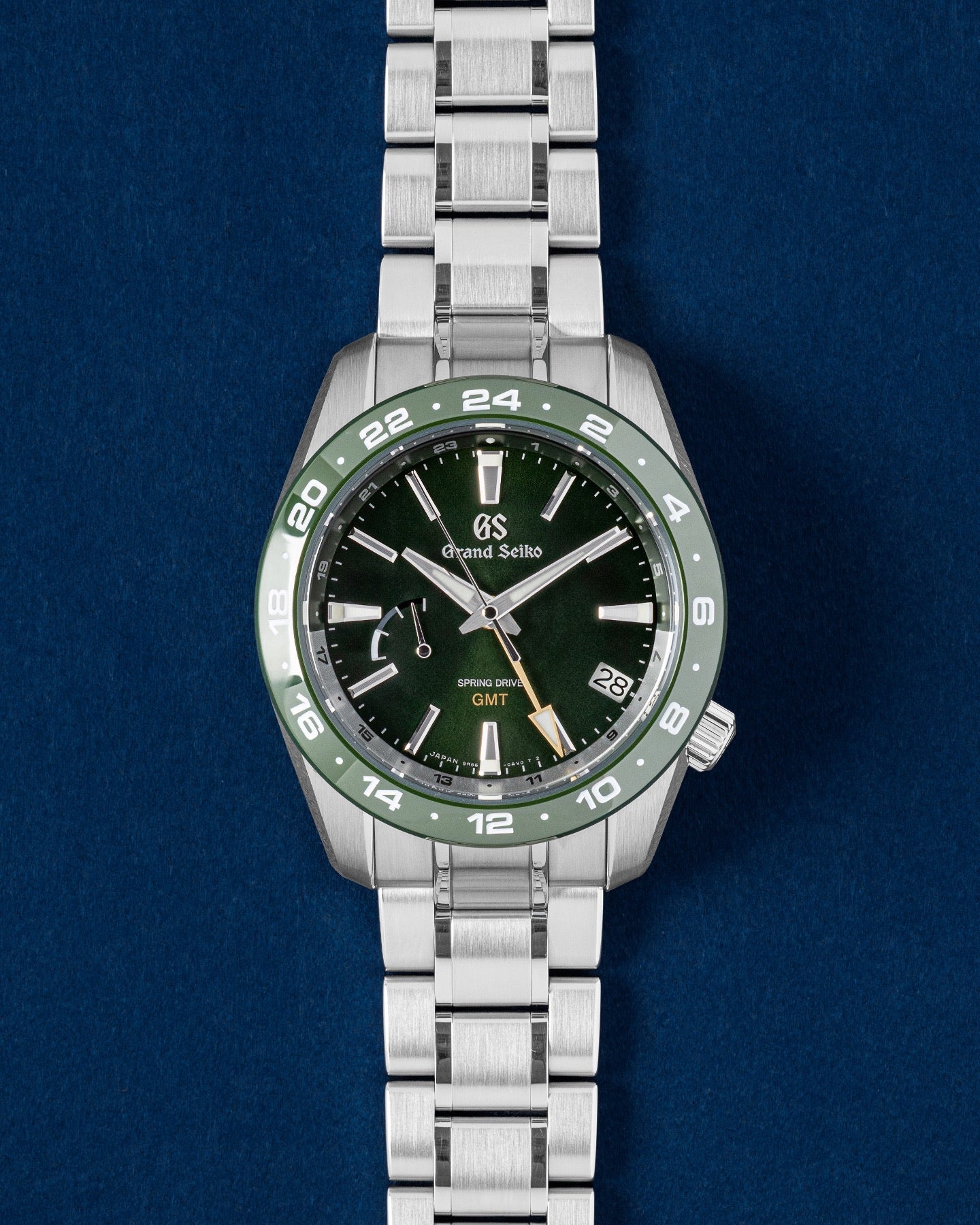 Grand Seiko Sport Collection watch featuring a moss-green dial matching green ceramic 24-hour bezel and a yellow GMT hand