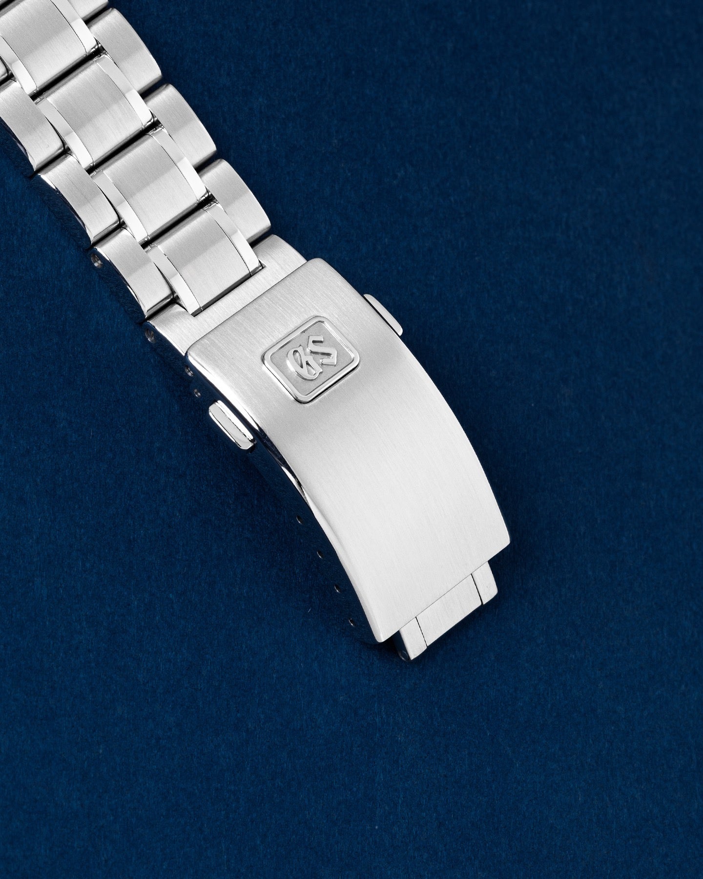 Exterior folding three-fold steel watch clasp featuring the embossed GS Grand Seiko brand monogram