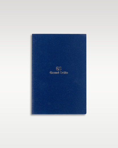 closed dark navy blue textured Grand Seiko international warranty certificate booklet holder