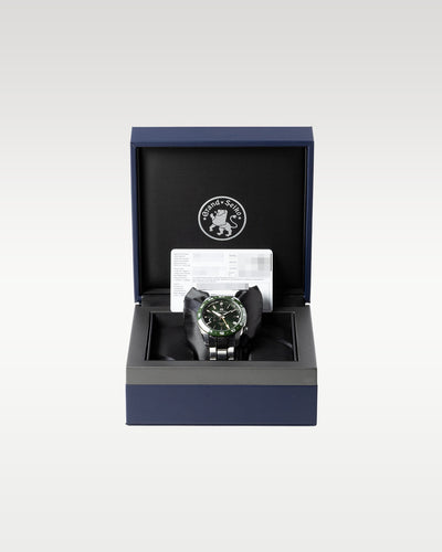 open luxury Grand Seiko inner presentation box lined with black plush fabric with a green SBGE257 watch