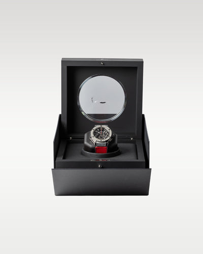 The complete retail collector presentation layout showing the Hublot Big Bang 301.SX.130.RX timepiece resting safely inside its inner black luxury display box featuring a circular glass porthole window at Grand Caliber in Dallas, Texas