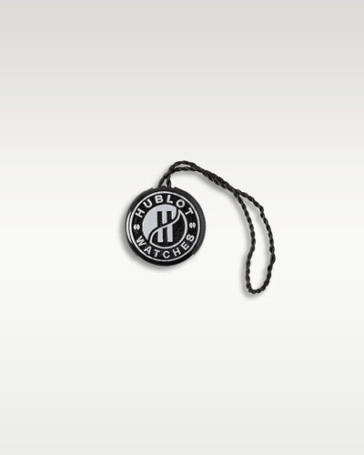 Official round black-and-white Hublot Genève collector's brand security seal hang tag