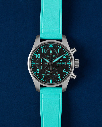 Brand new 2026 IWC Pilot's Watch Chronograph 41 Mercedes-AMG Petronas F1 Team IW388108 titanium watch on a green rubber strap at Grand Caliber Dallas