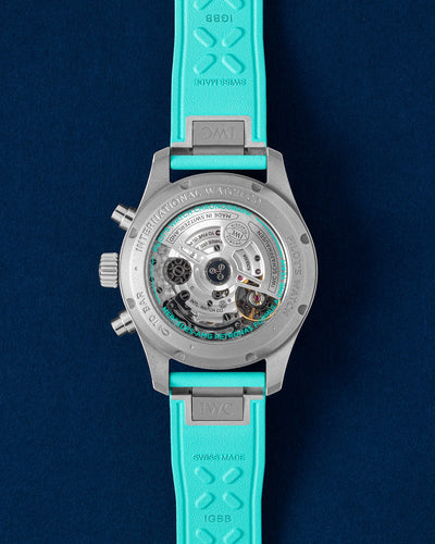 Sapphire crystal exhibition caseback displaying the column-wheel automatic IWC Calibre 69385 chronograph movement within a titanium case