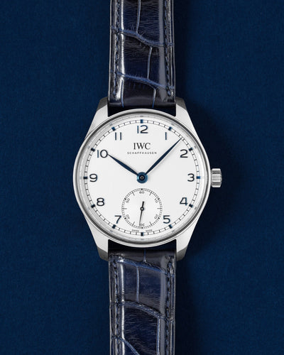 Pre owned 2020 IWC Portugieser Automatic 40 IW358304 steel watch with silver dial and blue numerals on a blue alligator leather strap at Grand Caliber Dallas