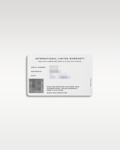 The back of the official white IWC Schaffhausen international limited warranty card displaying the printed serial number