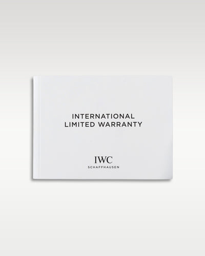 The official white square IWC international limited warranty booklet laid flat centered on a light background