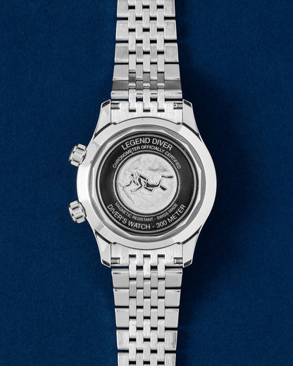 Solid stainless steel screw-down caseback featuring the embossed vintage scuba diver relief motif on a Longines Legend Diver 39