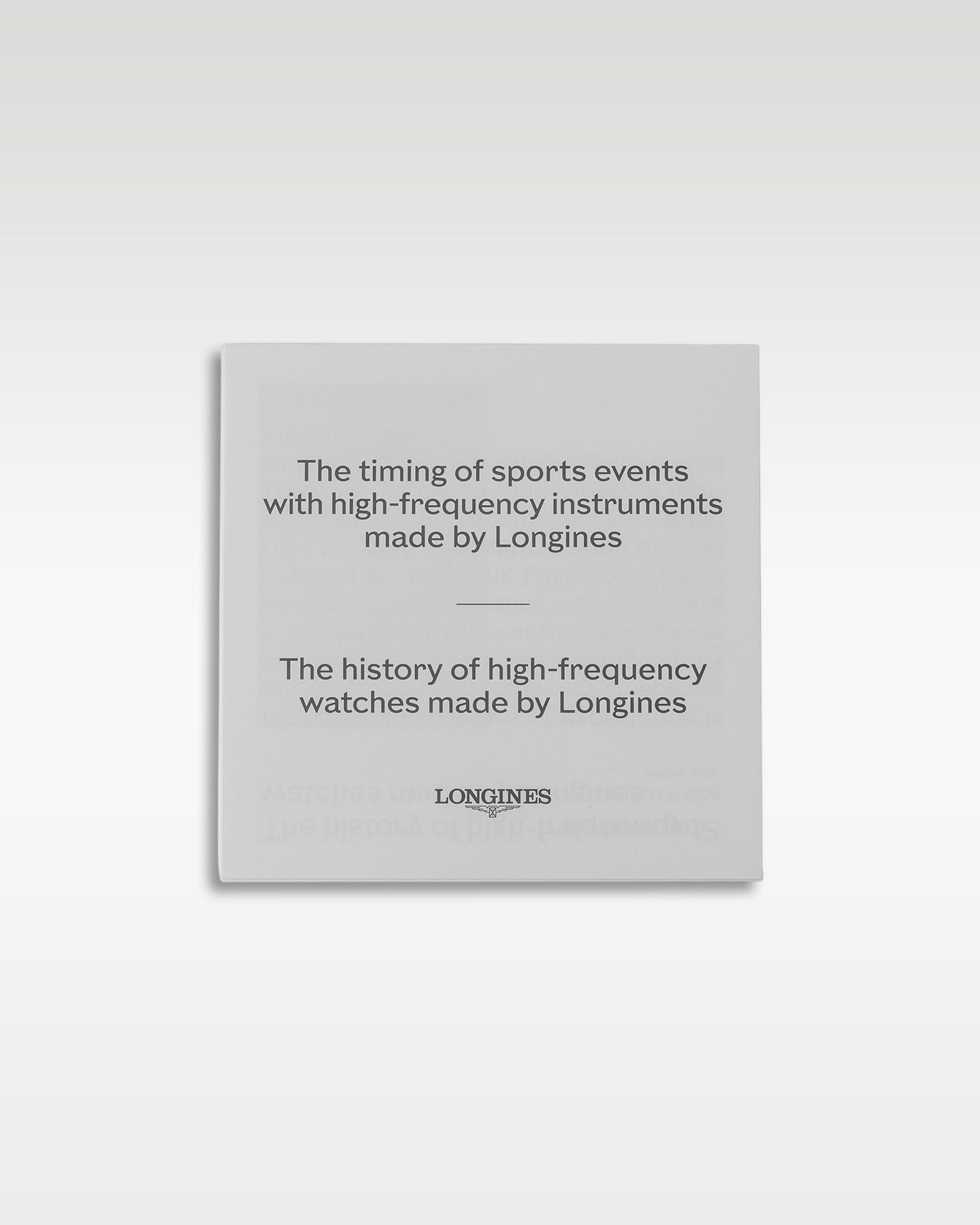 Official white Longines insert card detail detailing the history of sports events timing with high-frequency instruments