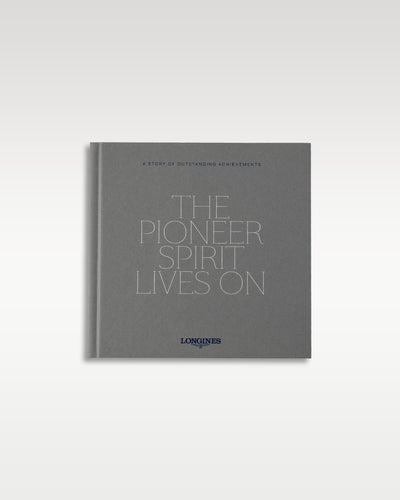 Official grey Longines brand heritage booklet titled The Pioneer Spirit Lives On instruction manual documentation
