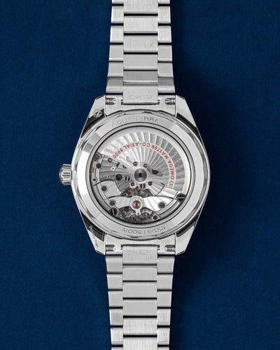 Sapphire crystal caseback view showcasing the automatic Omega Co-Axial Master Chronometer Calibre 8900 movement on a steel Aqua Terra
