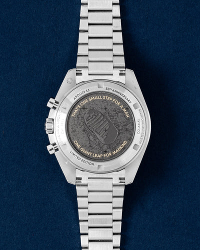 Laser-engraved caseback showing Buzz Aldrin descending from the lunar module on an Omega Speedmaster Apollo 11 50th Anniversary watch