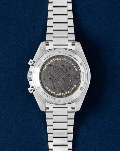 Laser-engraved caseback showing Buzz Aldrin descending from the lunar module on an Omega Speedmaster Apollo 11 50th Anniversary watch