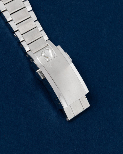 Close-up of the vintage-style flat-link stainless steel bracelet clasp on an Omega Speedmaster Moonwatch Apollo 11
