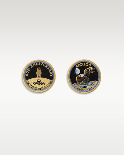 Pair of official Omega Speedmaster Apollo 11 50th Anniversary mission patch display coins side by side