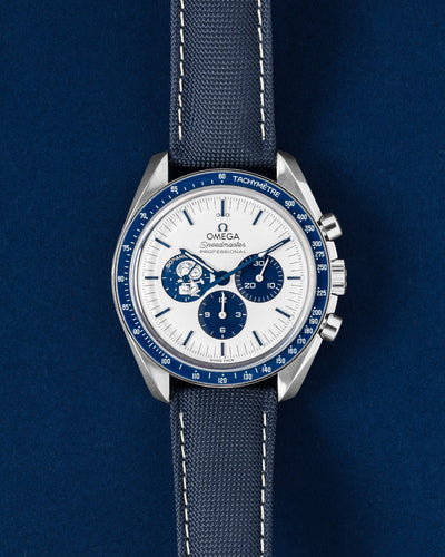Pre owned 2024 Omega Speedmaster Anniversary Series Silver Snoopy Award 50th Anniversary 310.32.42.50.02.001 watch at Grand Caliber Dallas