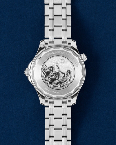 Rear studio view of the 75th anniversary Omega Seamaster case showing the solid steel caseback beautifully engraved with Poseidon and seahorses