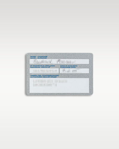 A top down view of the plastic registration warranty card displaying original identification text for the Panerai Luminor Marina Logo PAM 00005 at Grand Caliber in Dallas, Texas