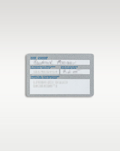 A top down view of the plastic registration warranty card displaying original identification text for the Panerai Luminor Marina Logo PAM 00005 at Grand Caliber in Dallas, Texas