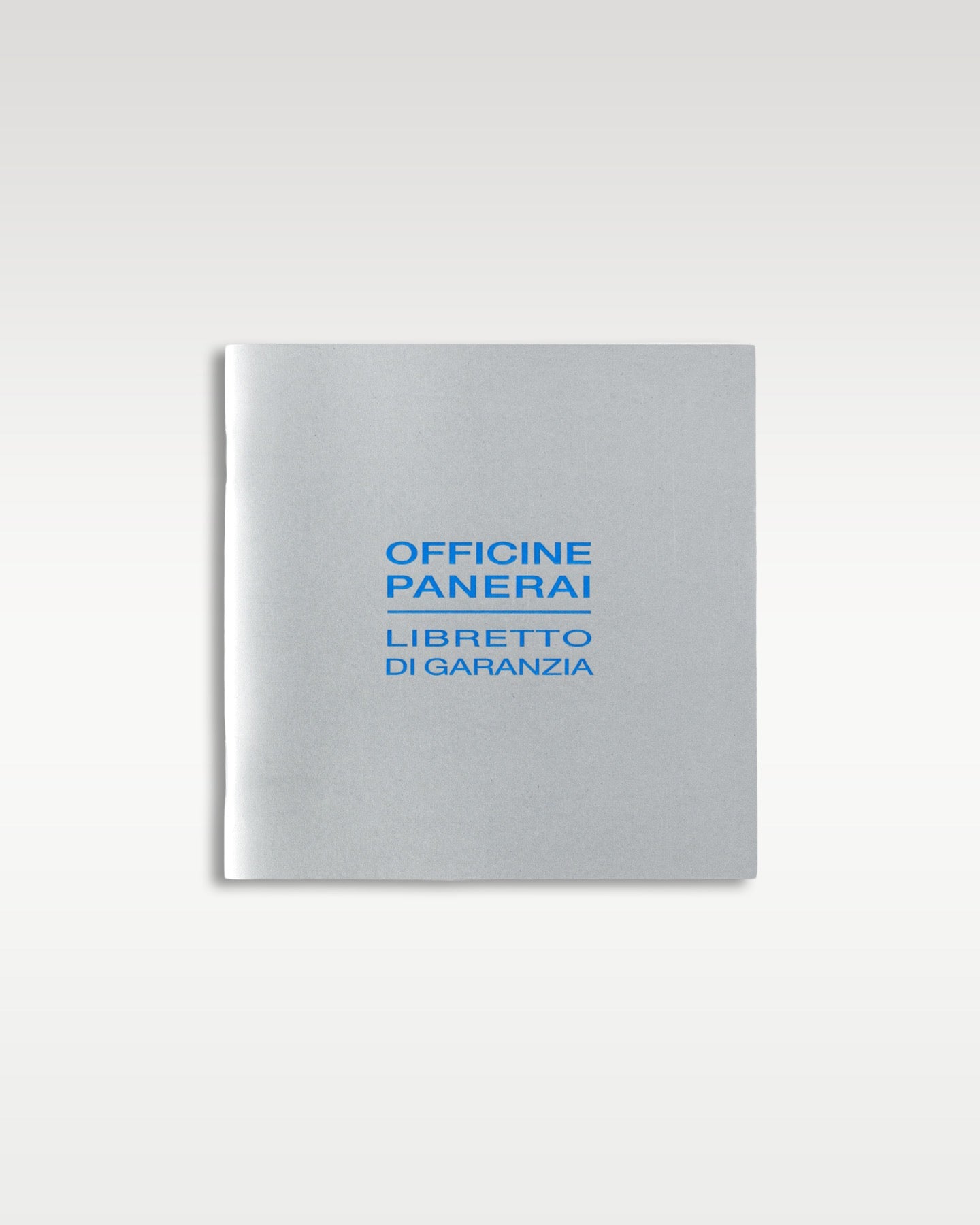 A straight front profile of the silver grey Libretto di Garanzia booklet included with the Panerai Luminor Marina Logo PAM 00005 at Grand Caliber in Dallas, Texas