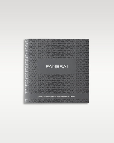 dark grey textured Panerai user instruction booklet and technical information manual resting flat in a studio presentation