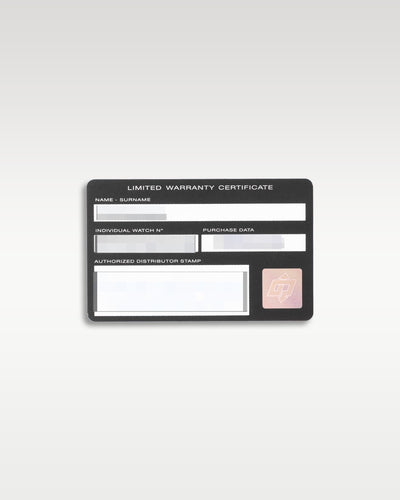 reverse side of the official plastic Panerai international warranty certificate card showing data fields flat-laid on a light studio background