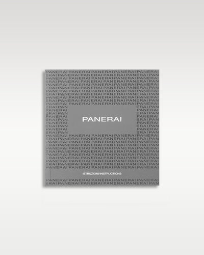 front cover of the dark grey Panerai international warranty and service booklet displayed flat on a white studio backdrop