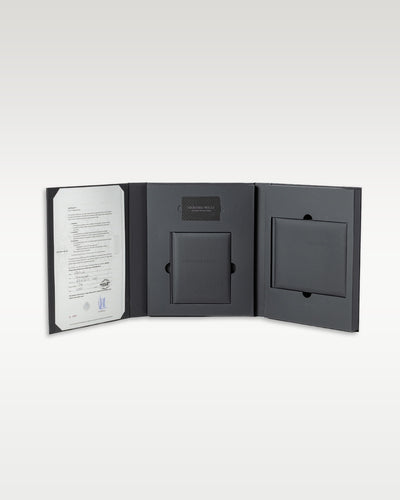 Official matte black Richard Mille technical leather trifold warranty portfolio folder containing the certificate of authenticity paper booklet