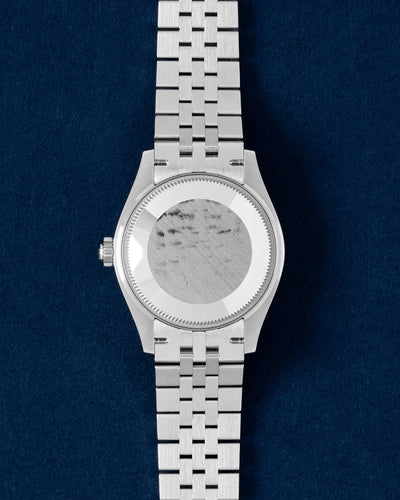 Solid screw-down Oystersteel caseback view of a mid-size 31mm Rolex Datejust luxury watch